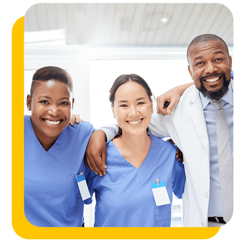 doctor and nurses smiling at camera