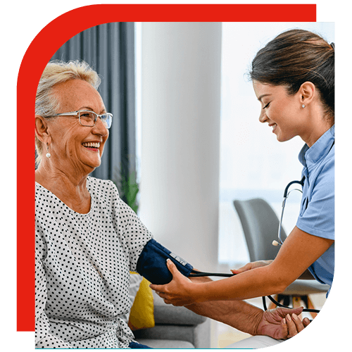 famale nurse taking older woman's blood pressure