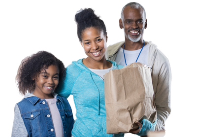 smiling family holding grocery bag