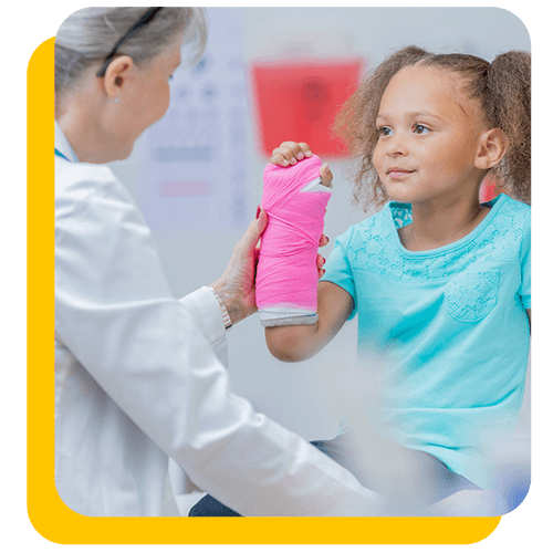 Doctor putting a cast on little girls broken arm